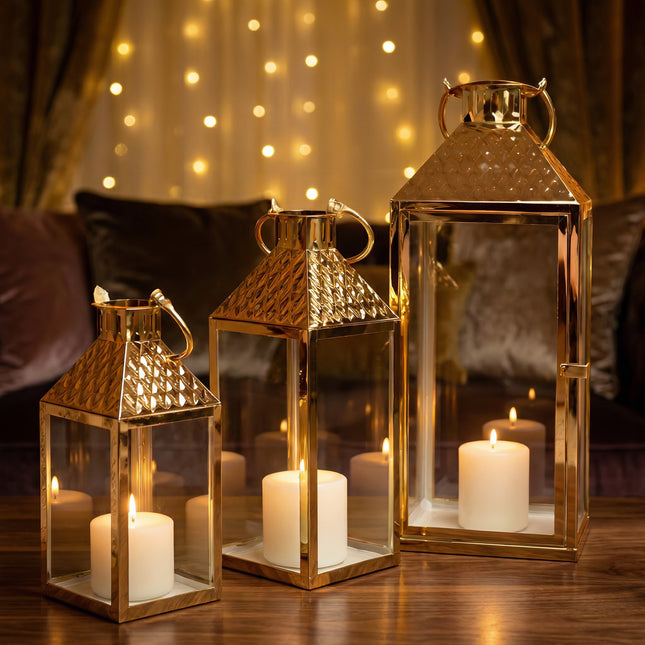طقم فوانيس زجاج ومعدن مطلي ذهبي – 3 قطع (صغير/وسط/كبير)